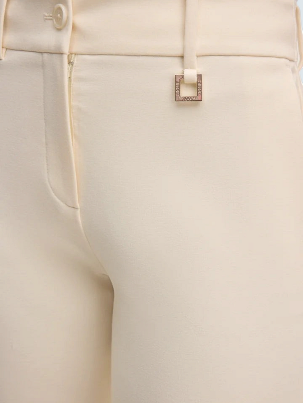 Елегантні кремові штани slim-fit від oui-ua.store з поясом, шлейками та декоративною металевою фурнітурою