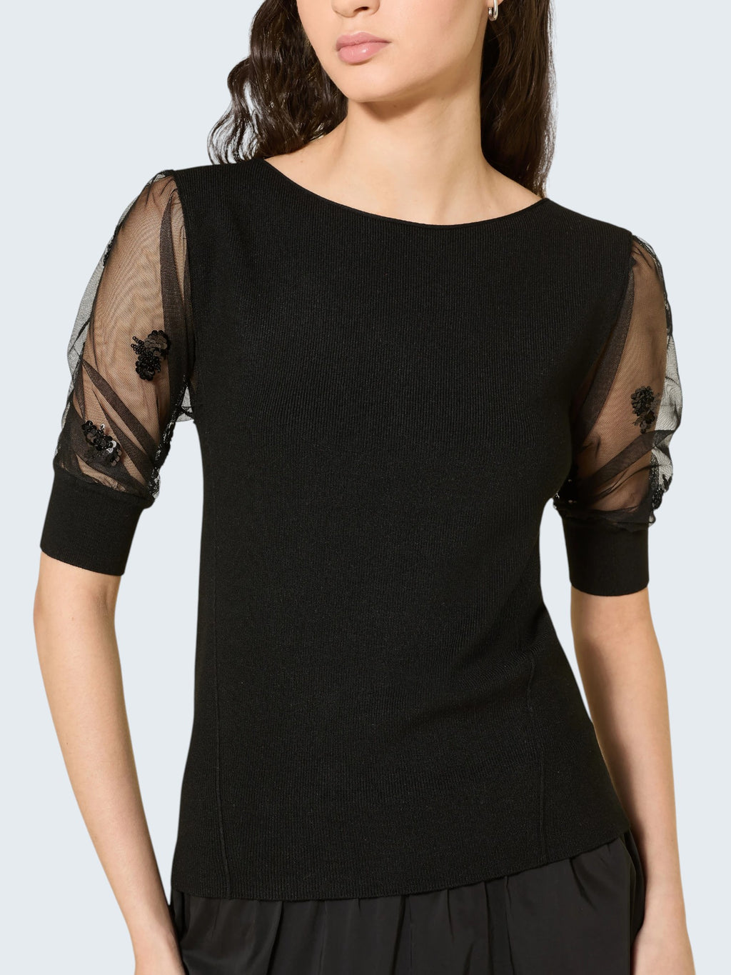 oui-ua.store black knit jumper with sheer mesh sleeves adorned with sequins and floral embroidery.
