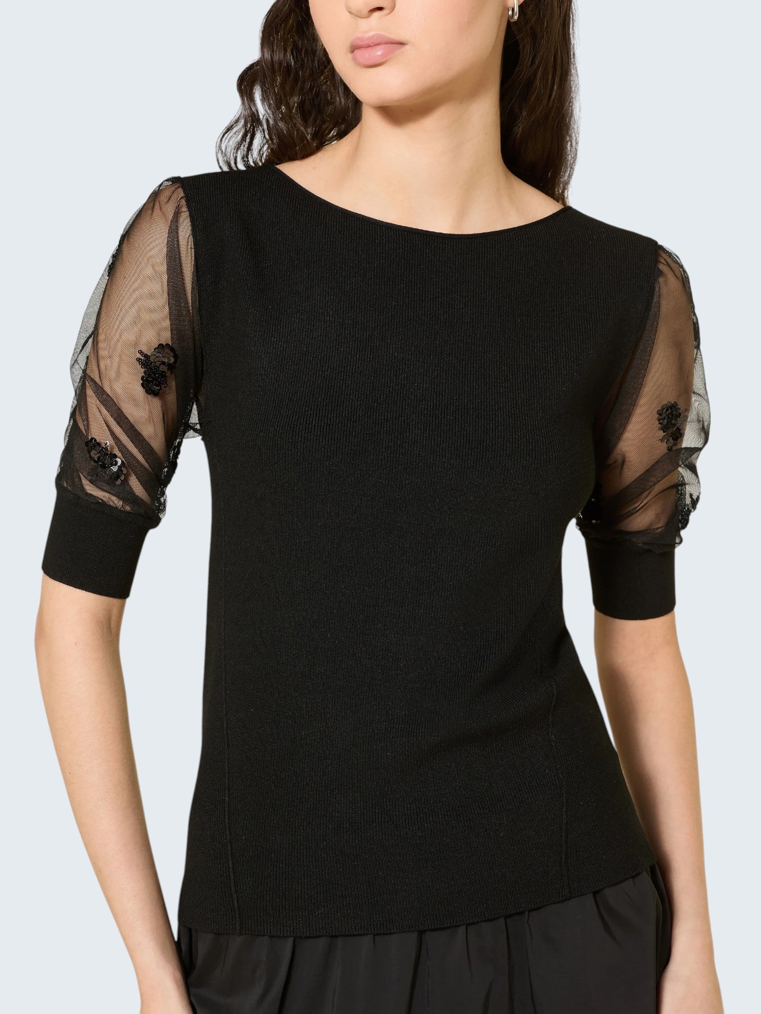 oui-ua.store black knit jumper with sheer mesh sleeves adorned with sequins and floral embroidery.
