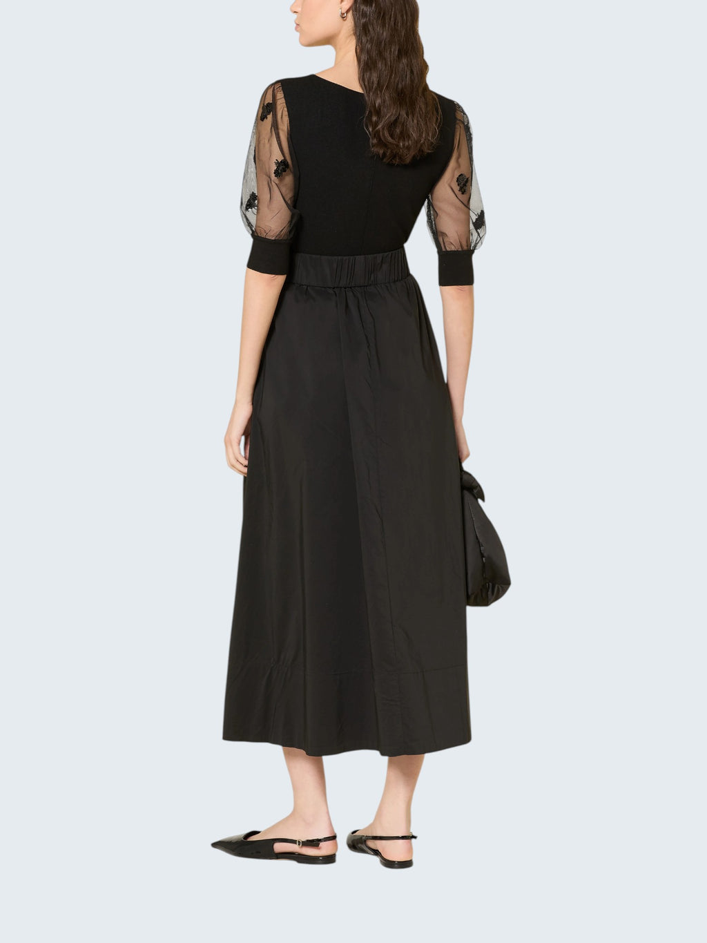 oui-ua.store black ribbed knit jumper with sheer mesh sleeves adorned with floral embroidery and sequins.