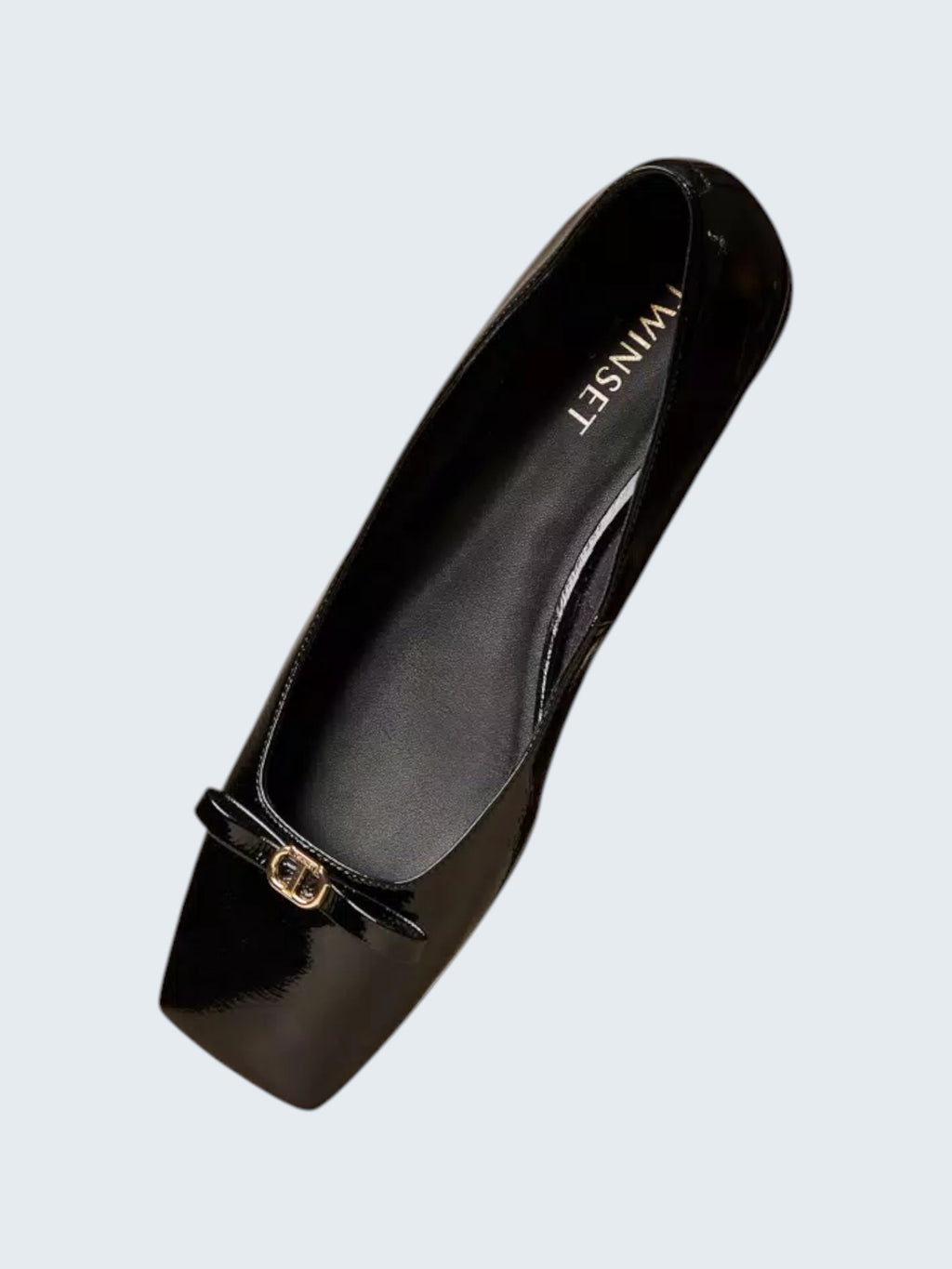 oui-ua.store black patent leather ballet flats with decorative bow and gold Oval T detail. Square toe.