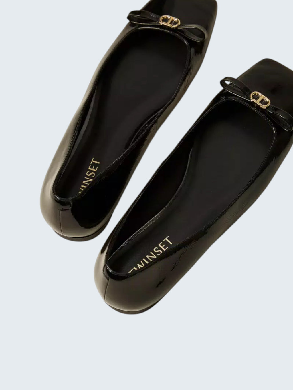 oui-ua.store black patent leather ballet flats with decorative bow and gold hardware. Square toe.