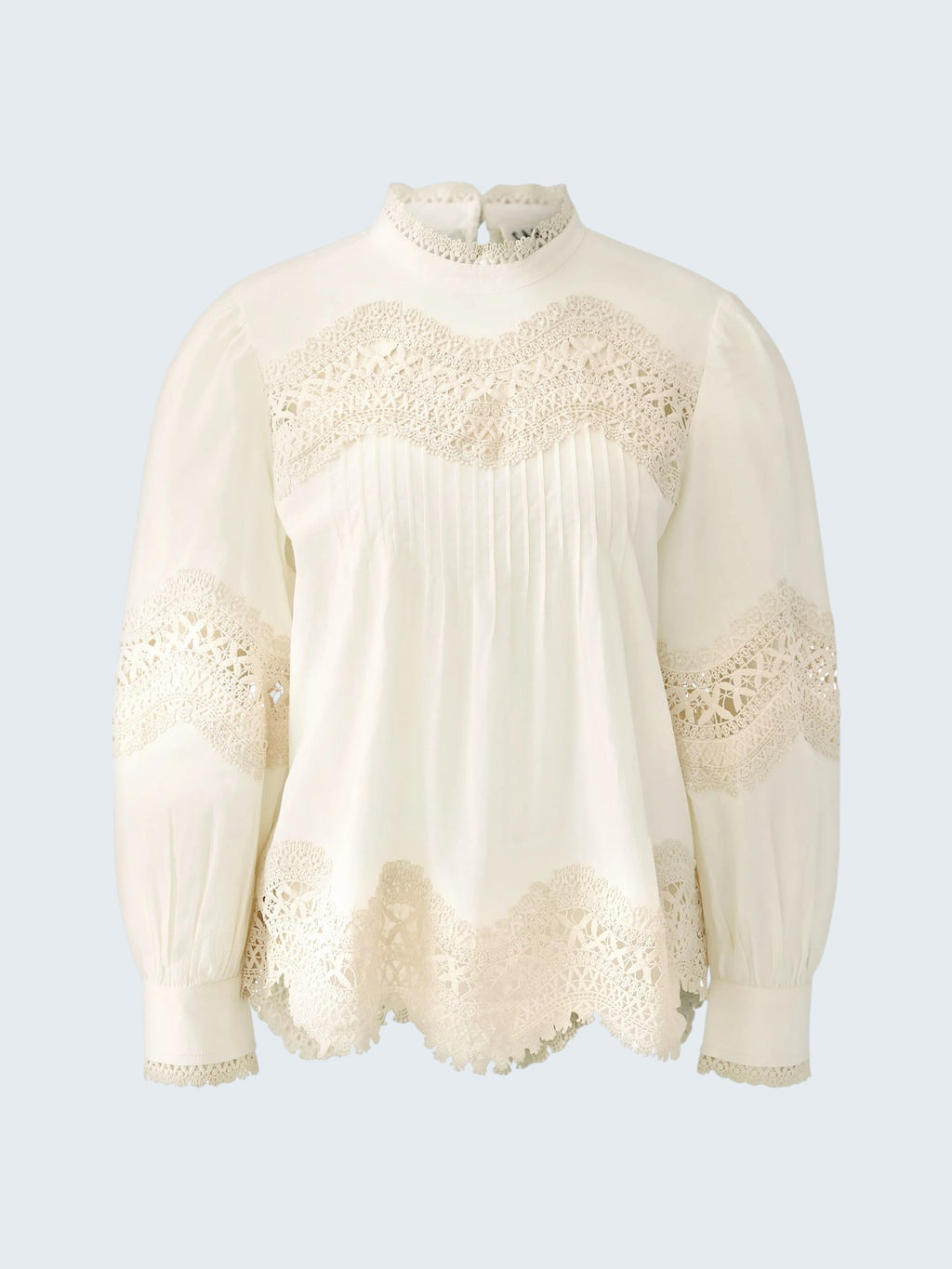 oui-ua.store cream cotton blouse with lace trim, pintuck details, high neck, and button back. Voluminous sleeves.