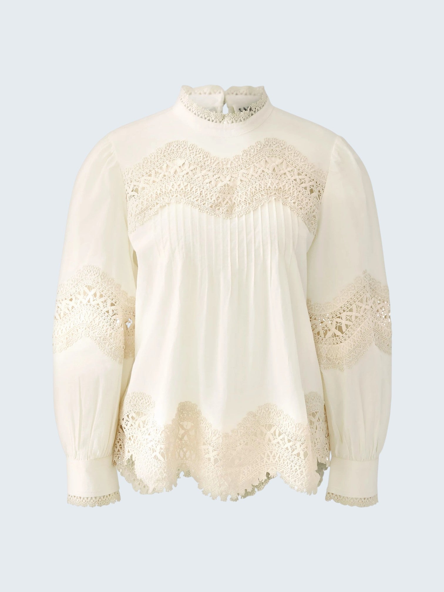 oui-ua.store cream cotton blouse with lace trim, pintuck details, high neck, and button back. Voluminous sleeves.